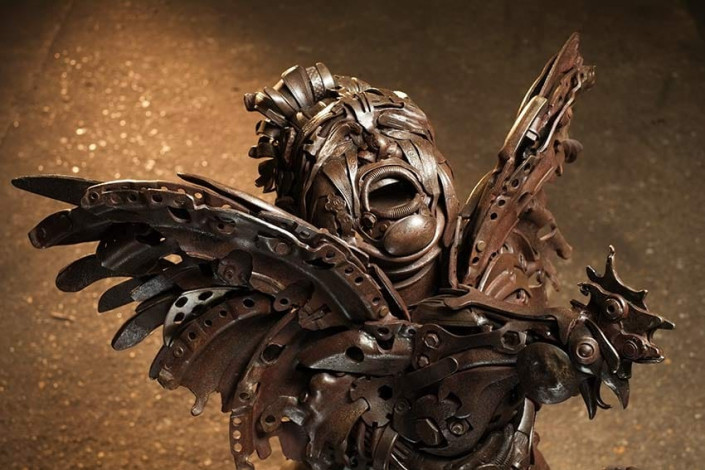 Boy with Chicken metal sculpture details made by metal sculpture artist, Alan Williams