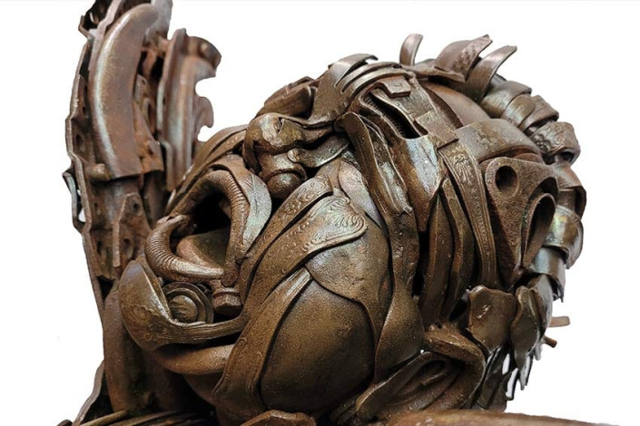 Boy with Chicken face details - metal artwork by Alan Williams