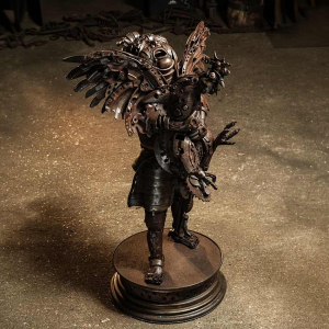 Boy with chicken sculpture by Alan Williams Metal Artist