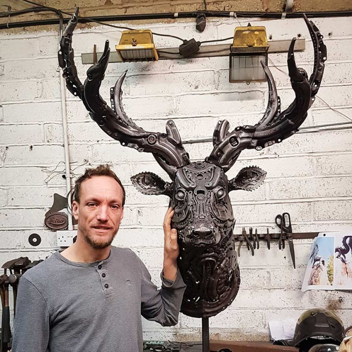 Alan Williams with metal stag sculpture Spirit of the Forest 2018