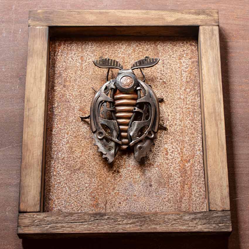 Moth sculpture by Alan Williams in reclaimed metal and a jarrah hardwood frame Full view of Moth, a framed reclaimed metal sculpture by Alan Williams, 2025