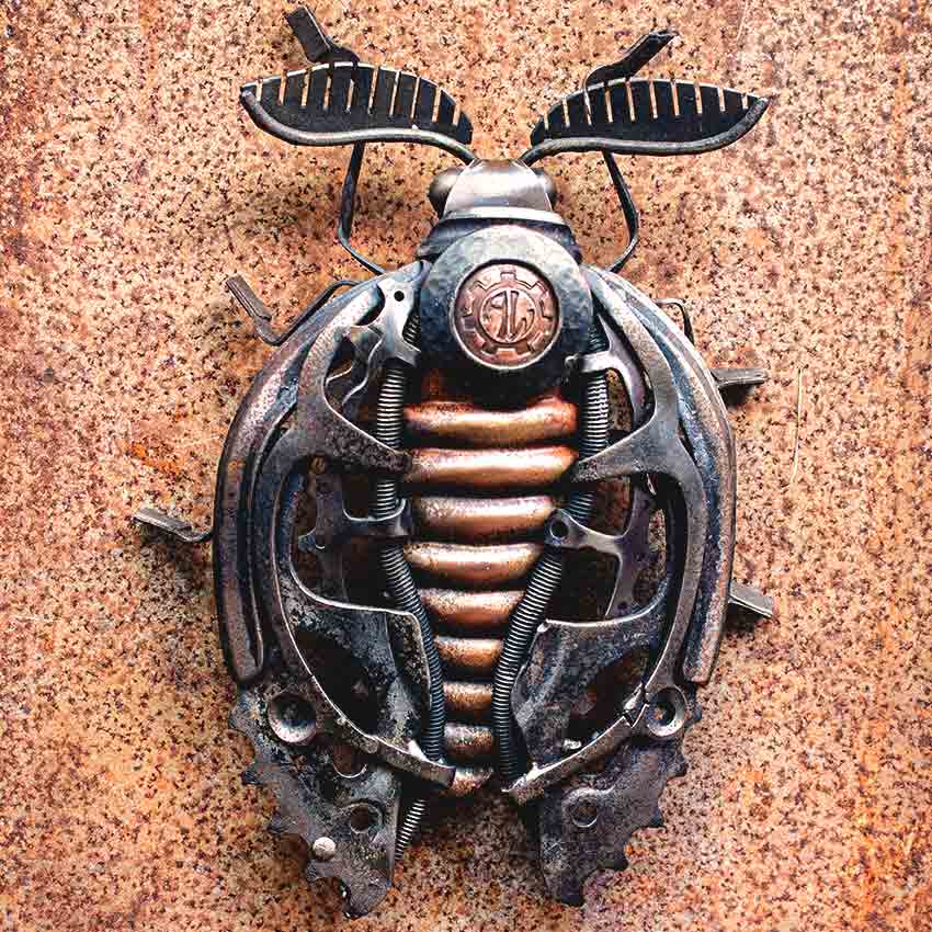 Close view of Moth sculpture metalwork Close-up of the metal moth showing typewriter components and forged mechanical parts