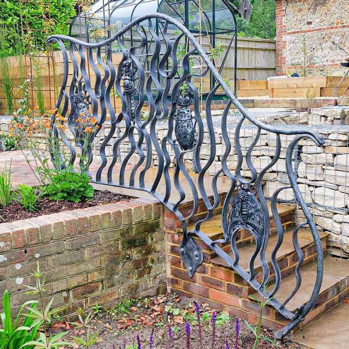 Bug Handrail Architectural garden sculpture created by Metal Sculpture Artist Alan Williams 2024