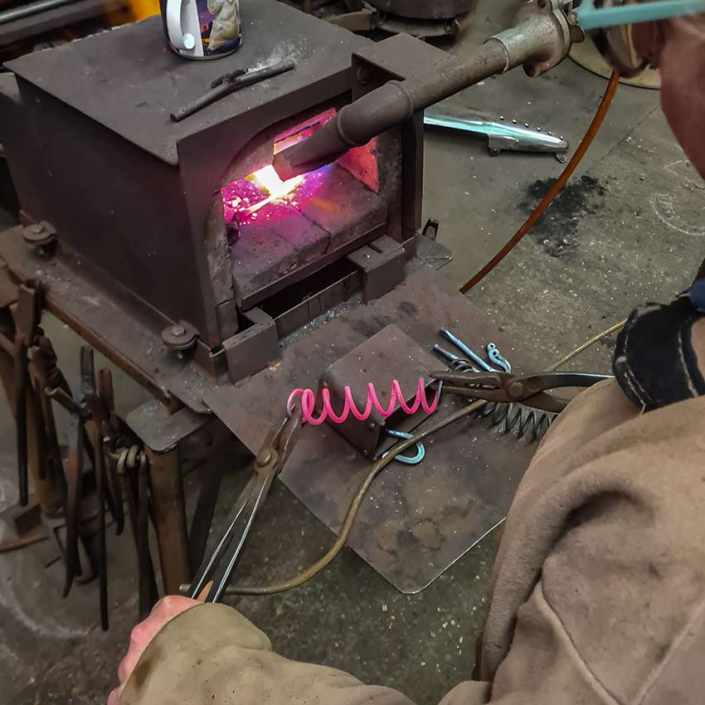Learning to use the forge with Alan Williams at his Metalworking workshops in Henfield Sussex